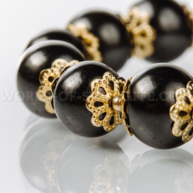 Bracelet with golden roses on the elastic band