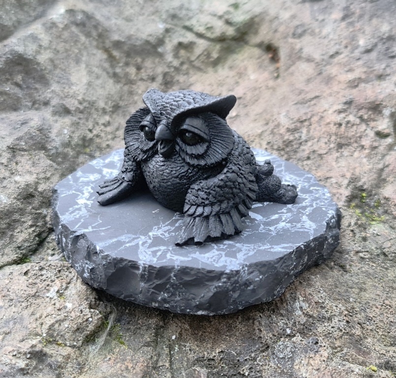 Figure lying owl