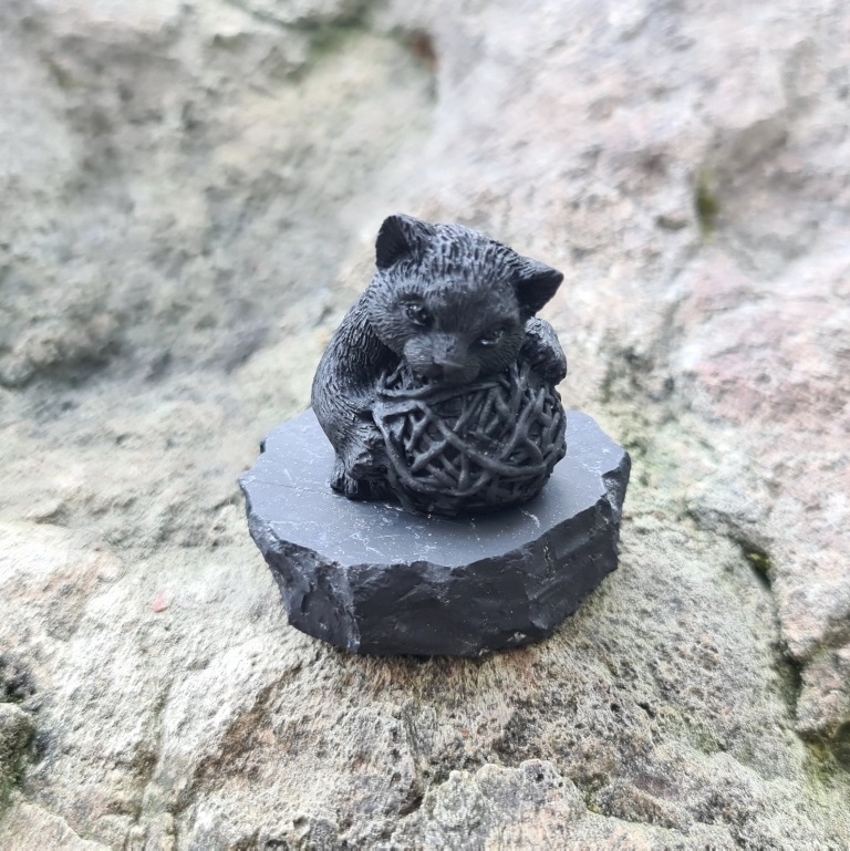 Shungite kitten figurine with a ball