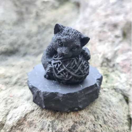 Shungite kitten figurine with a ball