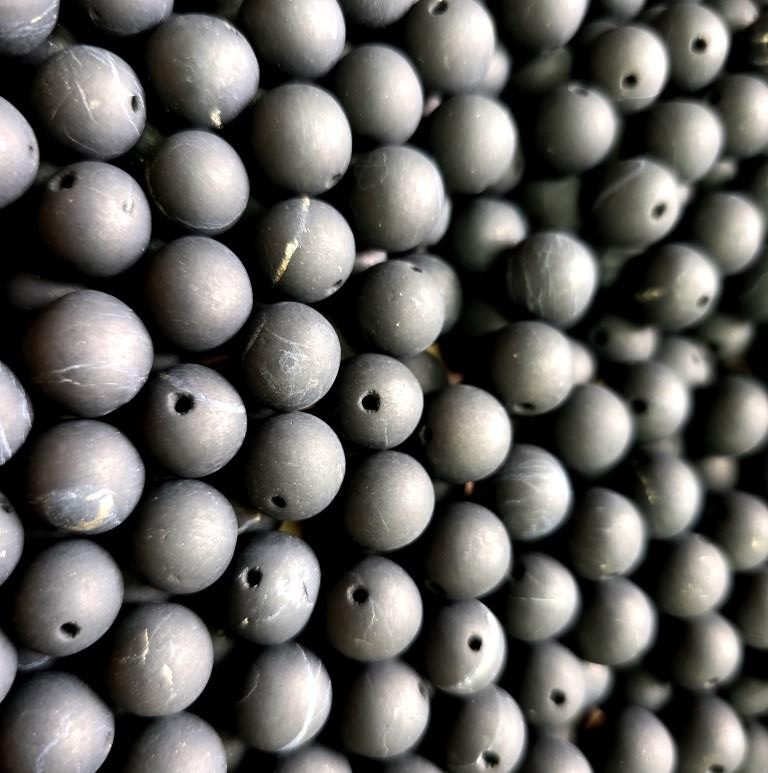 Placer of beads 10 mm (unpolished beads with holes)